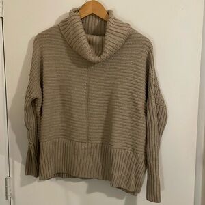 Oversized XS sweater. Tan in color.